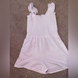 white romper, never been worn. size medium, white.